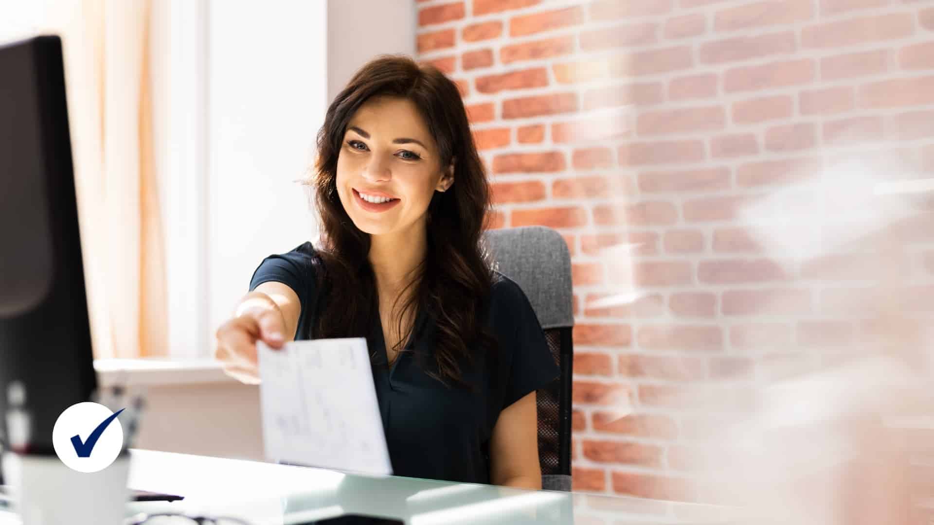 Person handing out payroll check